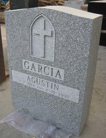 Grey tombstone with cross